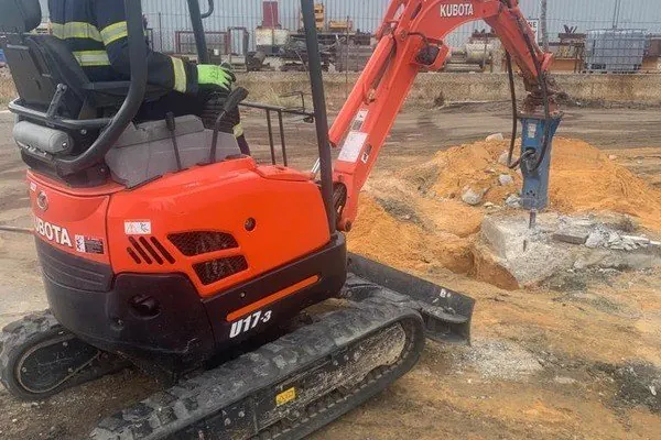 Mini excavator with a rock breaker on a Perth site